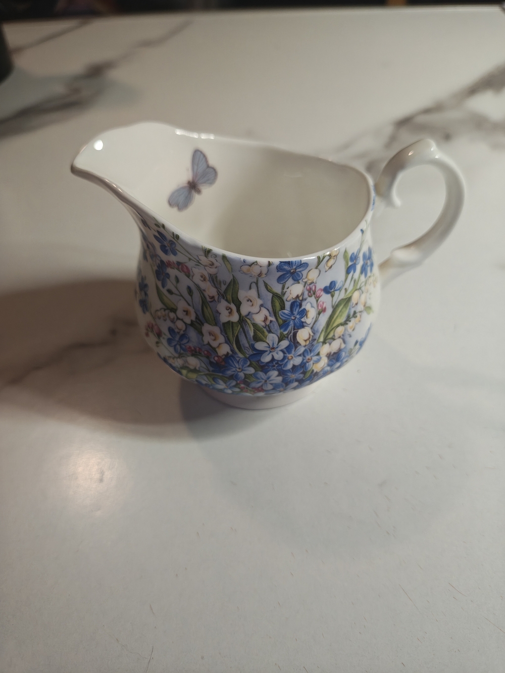 Blue Floral Porcelain Creamer with Butterfly Accent - Elegant Tableware